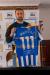 Glenn-Murray-111-Shirt-Holding-logo